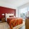 bedroom with city views and access to private balcony