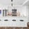stools at island kitchen with pendant lighting